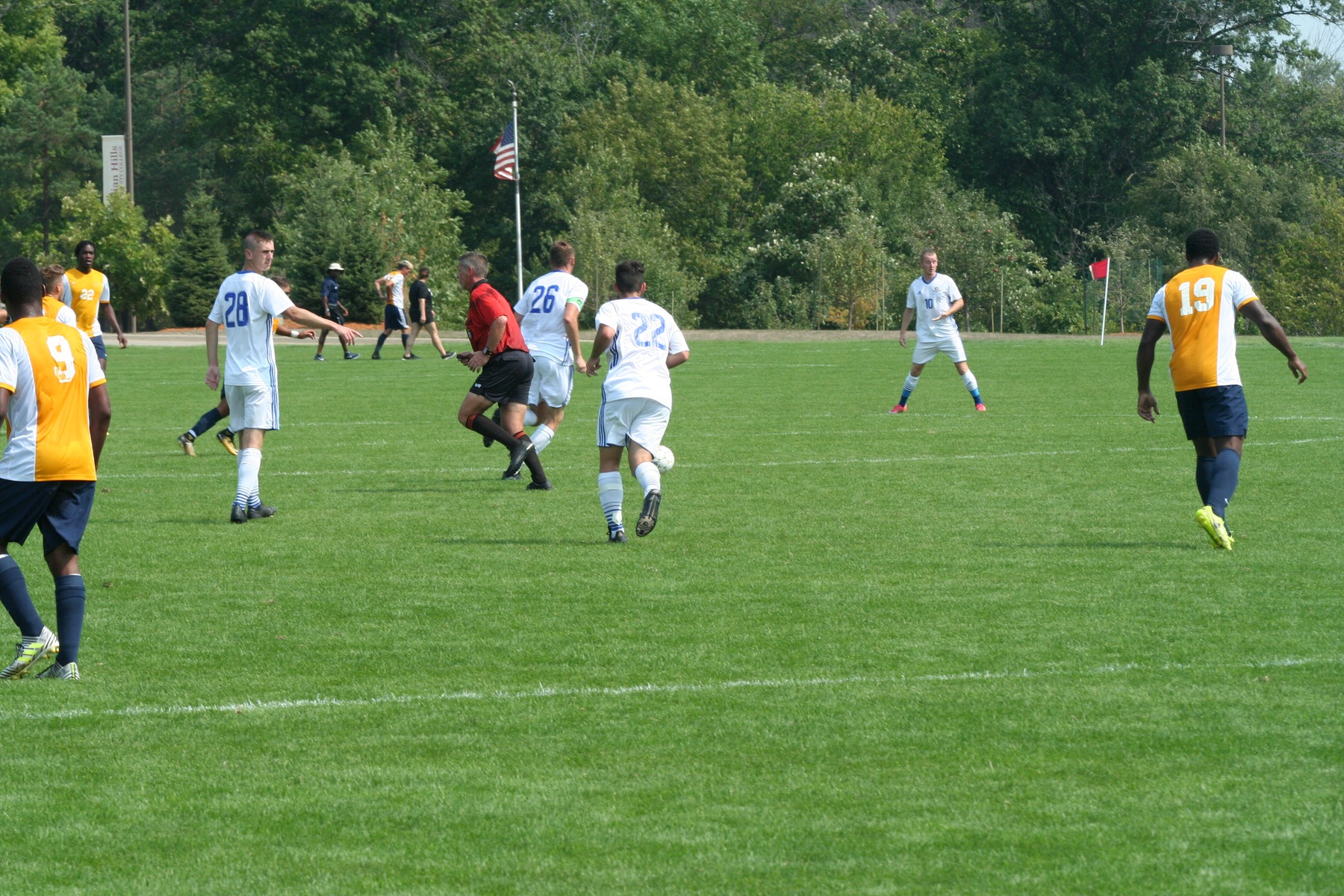 Defender James Paylor looks to find mid-fielder Charlie Hackshall in the middle of the pitch.